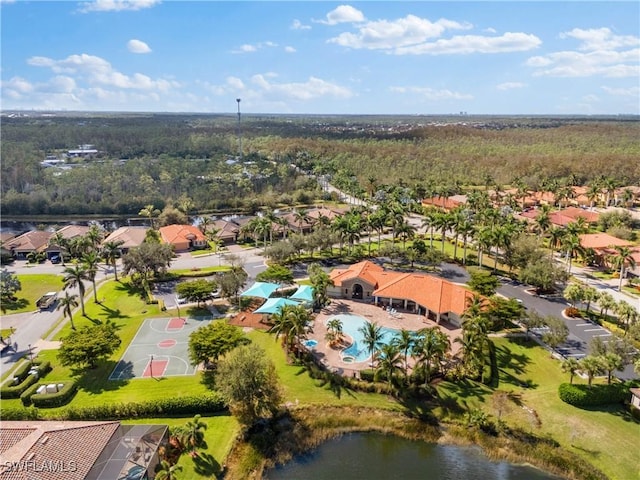 birds eye view of property with a water view