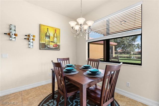 dining space with a notable chandelier and light tile patterned flooring