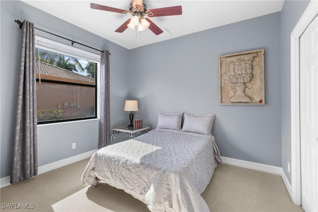 carpeted bedroom with ceiling fan