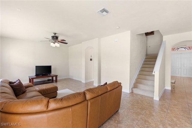 living room featuring ceiling fan and light tile patterned flooring