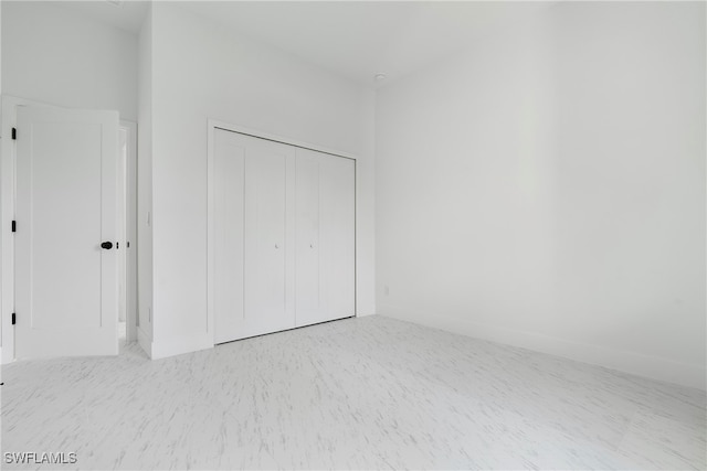 unfurnished bedroom with a closet