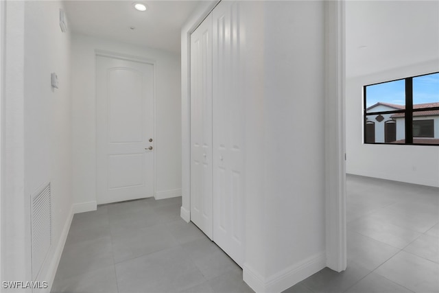 hallway with light tile patterned flooring