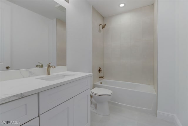 full bathroom featuring vanity, tiled shower / bath combo, and toilet