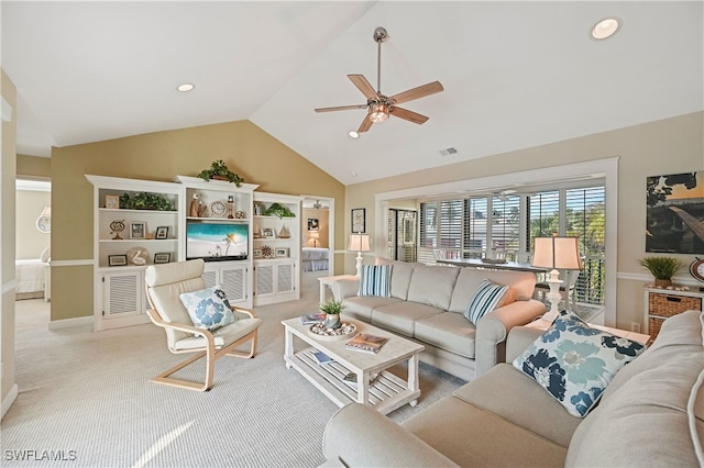 carpeted living room featuring ceiling fan and vaulted ceiling