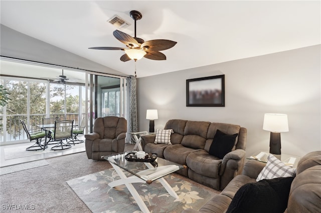 living room featuring vaulted ceiling, carpet flooring, and ceiling fan