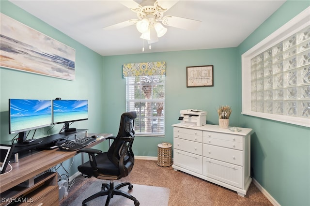 carpeted office with ceiling fan