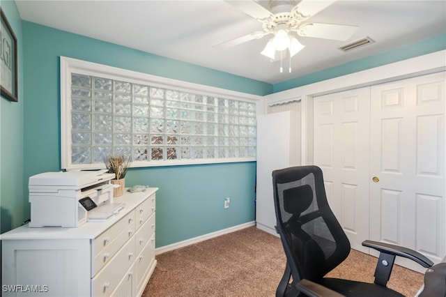 office area featuring ceiling fan and light carpet