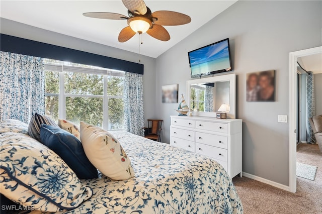 carpeted bedroom with multiple windows, vaulted ceiling, and ceiling fan