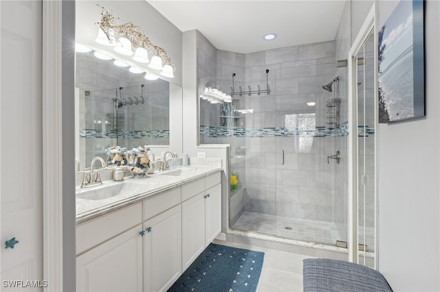 bathroom with vanity, tile patterned floors, and a shower with shower door