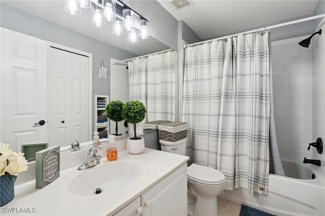 full bathroom featuring tile patterned flooring, vanity, shower / bath combination with curtain, and toilet