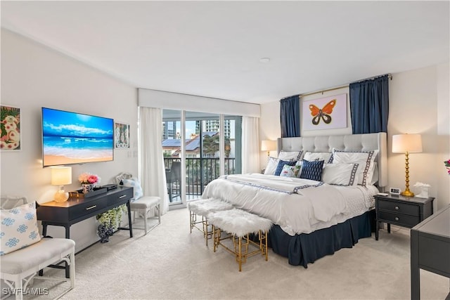 carpeted bedroom featuring access to outside