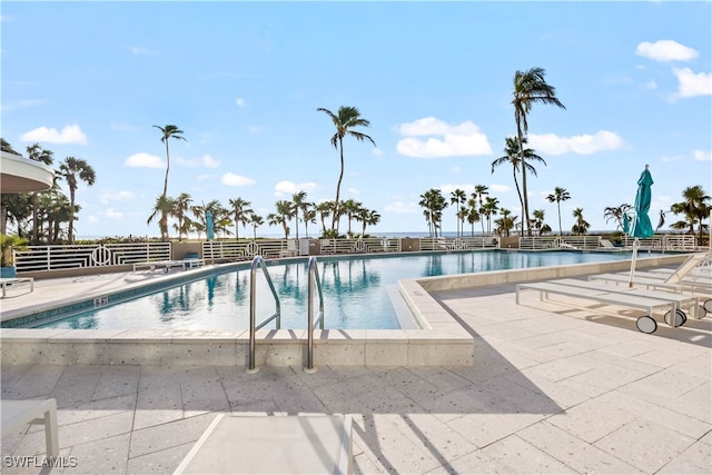 view of pool featuring a water view