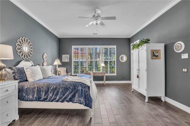 bedroom featuring wood tiled floor, crown molding, and baseboards