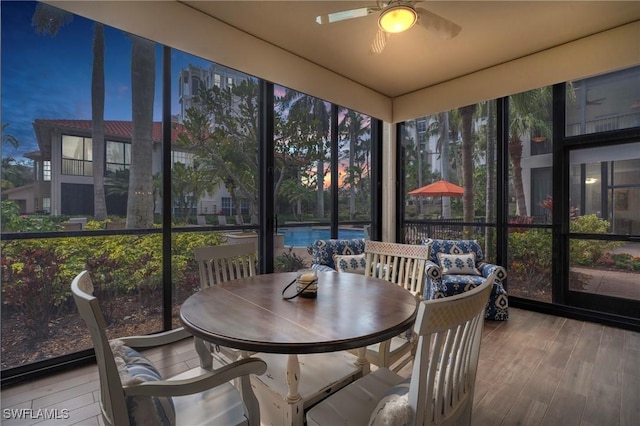 sunroom / solarium with ceiling fan