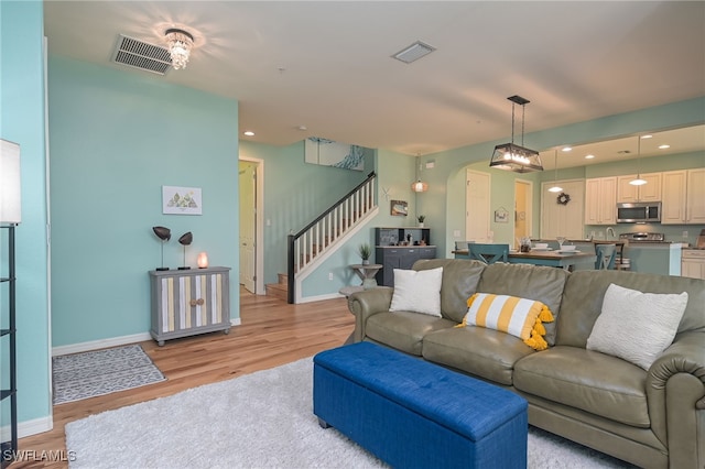 living room with light hardwood / wood-style floors