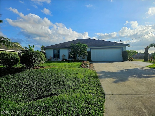 ranch-style house featuring a garage and a front lawn