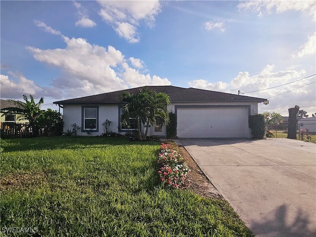 ranch-style home with a garage and a front lawn