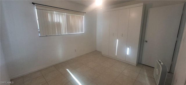 unfurnished bedroom featuring a closet