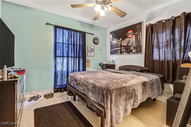 bedroom featuring ceiling fan and light tile patterned floors