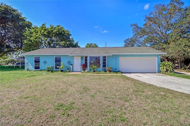 ranch-style house with a garage and a front lawn