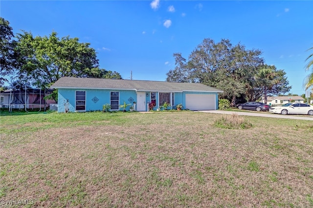 single story home featuring a garage and a front lawn