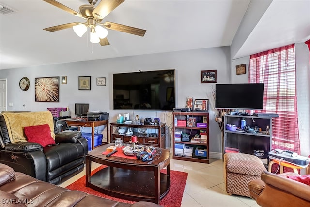 tiled living room with ceiling fan