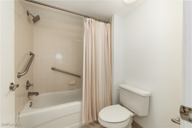 bathroom with shower / bath combo with shower curtain and toilet