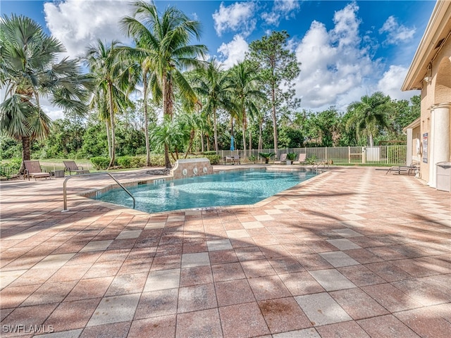 view of swimming pool with a patio area