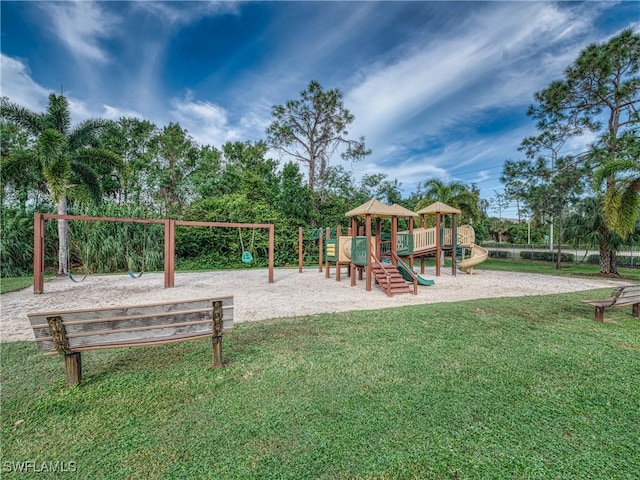 view of jungle gym with a lawn