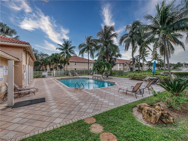 view of swimming pool with a patio