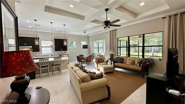 living room with beam ceiling, ceiling fan, coffered ceiling, crown molding, and light tile patterned floors