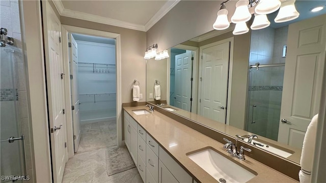 bathroom featuring crown molding, a shower with door, and vanity