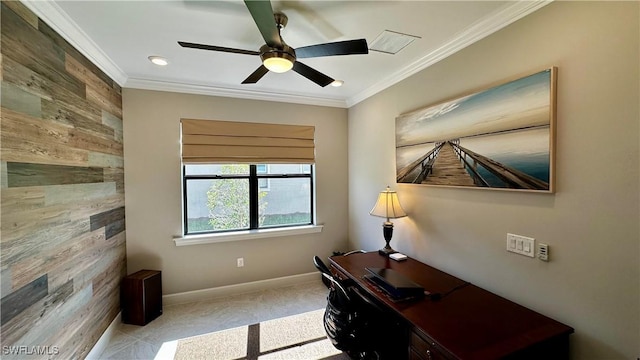 office space with visible vents, ornamental molding, a ceiling fan, wood walls, and baseboards