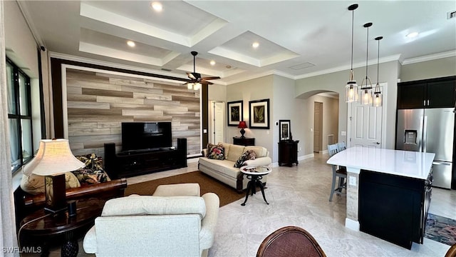 living area with arched walkways, crown molding, an accent wall, coffered ceiling, and baseboards