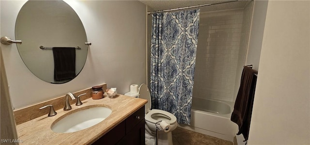 full bathroom with vanity, tile patterned floors, shower / bath combination with curtain, toilet, and a textured ceiling