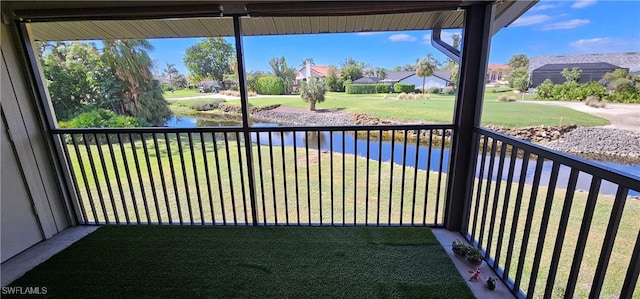 balcony featuring a water view