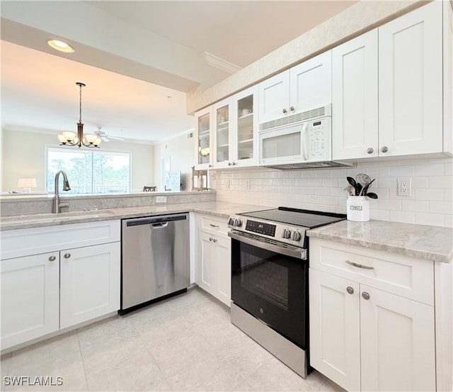 kitchen featuring white cabinetry, sink, and appliances with stainless steel finishes