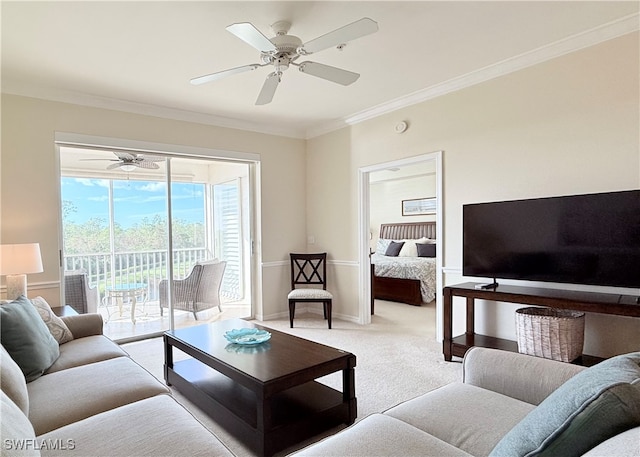 living room with light colored carpet, ceiling fan, and ornamental molding