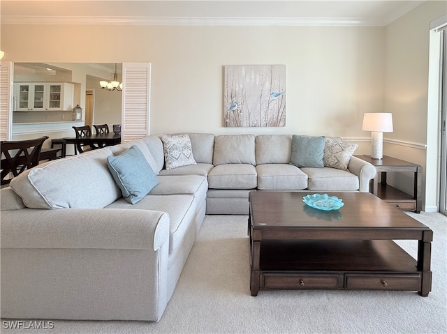 carpeted living room with ornamental molding and a notable chandelier