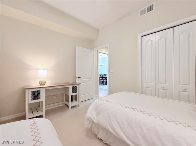 carpeted bedroom featuring a closet