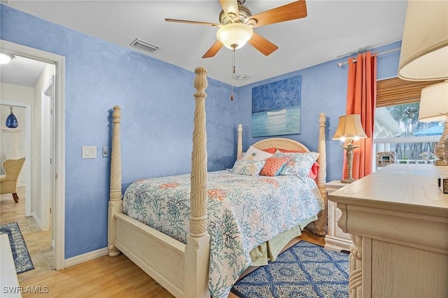 bedroom with ceiling fan and light hardwood / wood-style floors