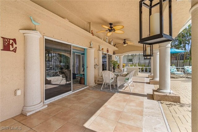 view of patio featuring ceiling fan