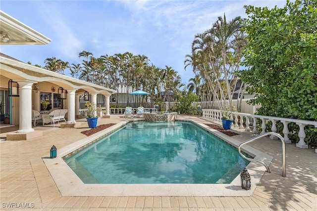 view of swimming pool with a patio