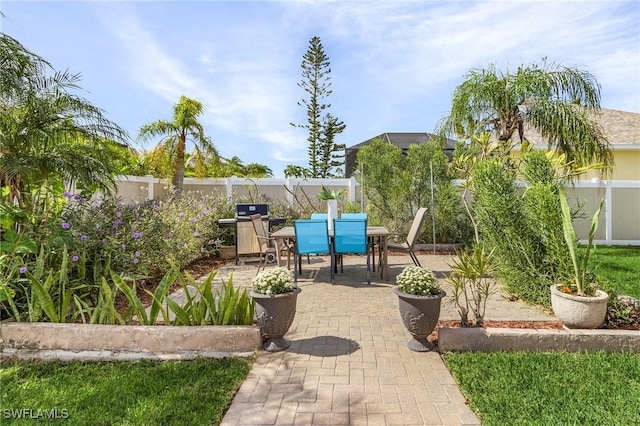 view of patio with a grill