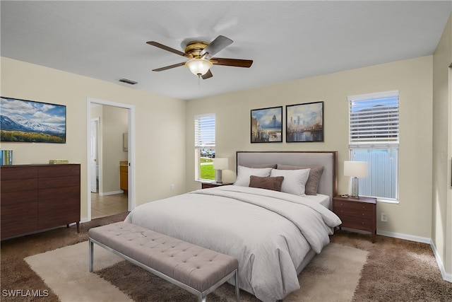 carpeted bedroom with ceiling fan