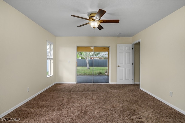 unfurnished room with ceiling fan and carpet floors