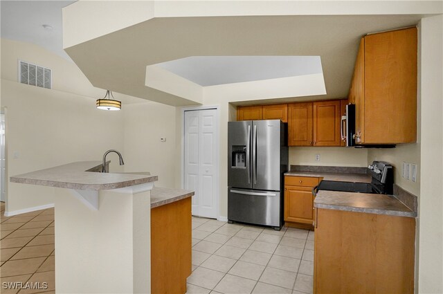 kitchen featuring stainless steel appliances, a kitchen breakfast bar, light tile patterned floors, lofted ceiling, and pendant lighting