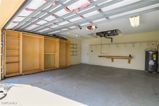 garage with a garage door opener and water heater