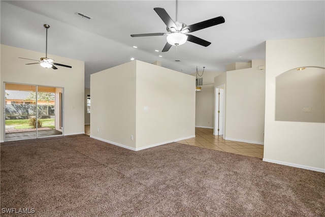 unfurnished living room with lofted ceiling, light colored carpet, and ceiling fan