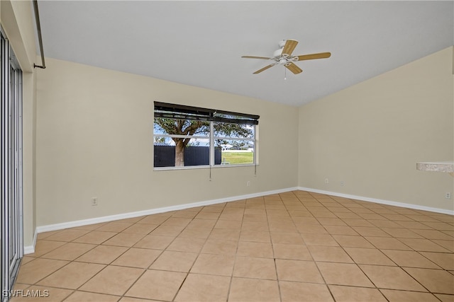 empty room with light tile patterned flooring and ceiling fan